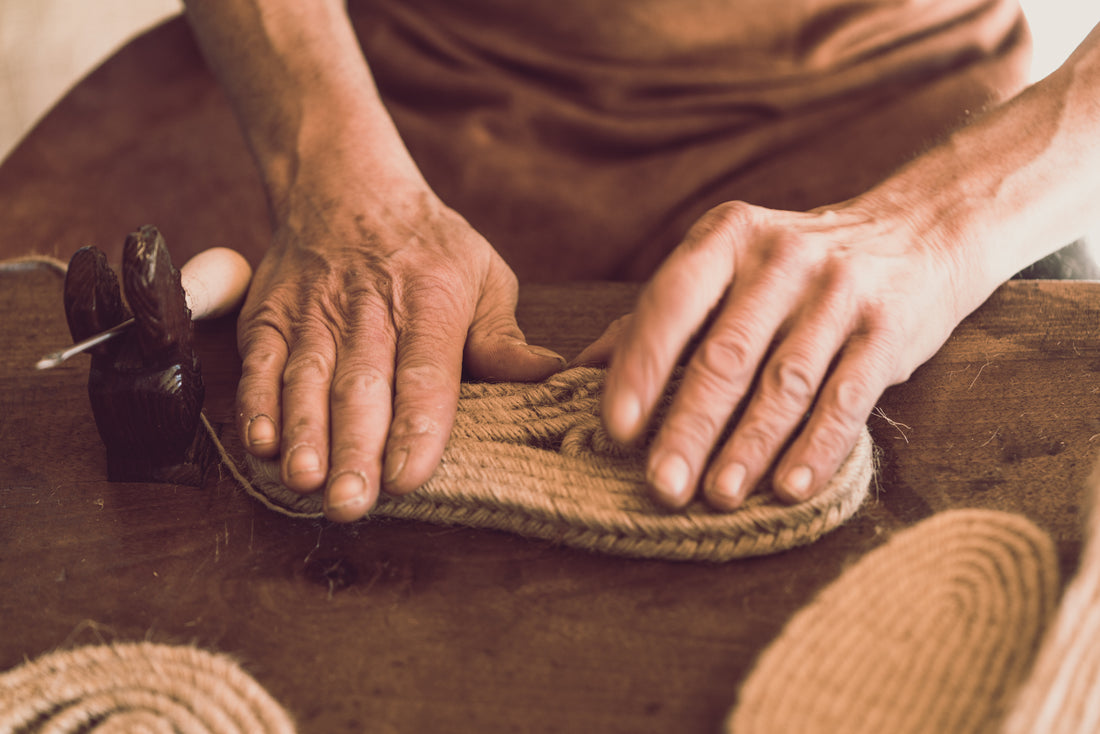 Artisan handcrafting espadrille sole