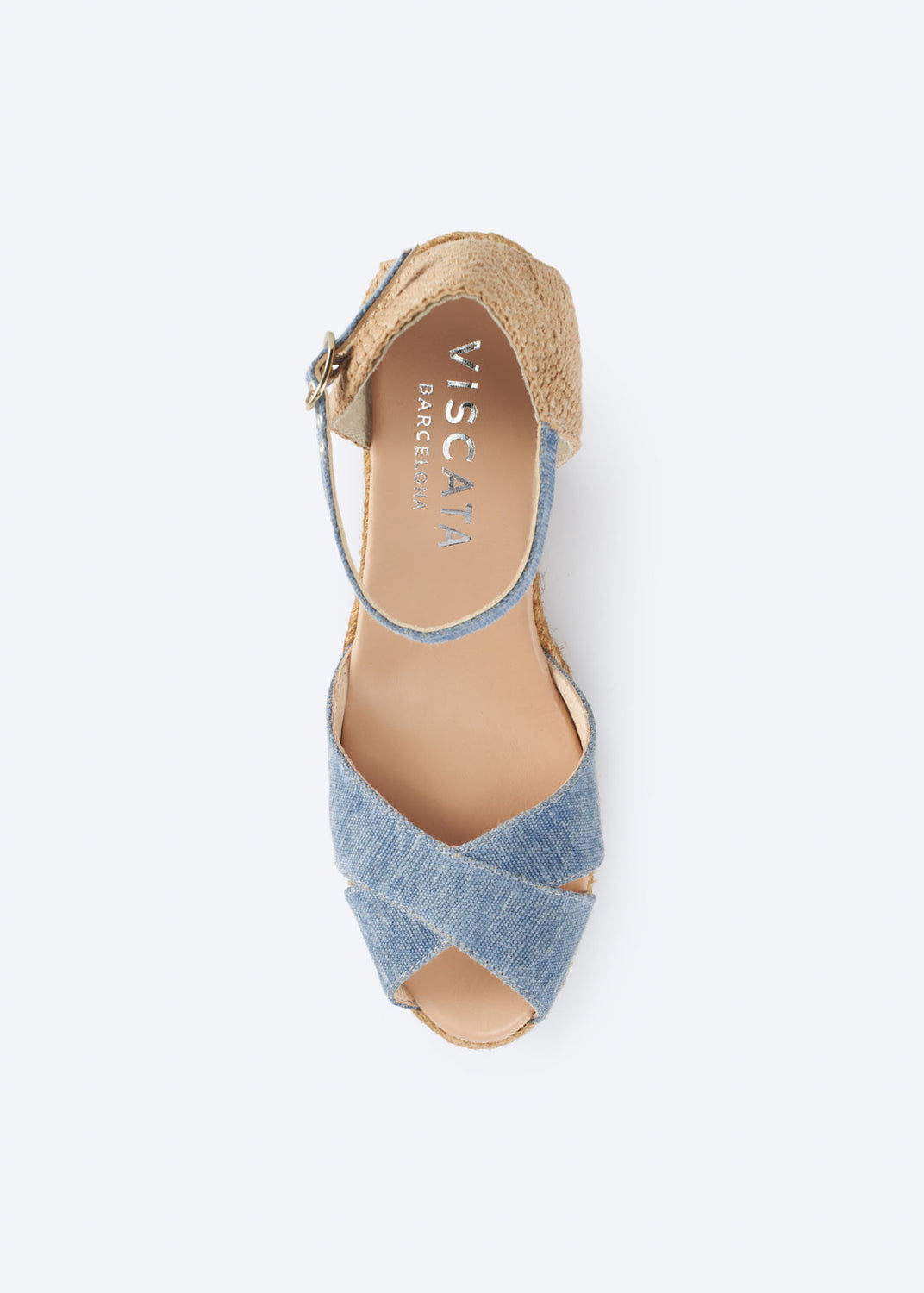 Top view of washed denim wedge espadrille sandal with crossover front straps, slingback strap, and natural braided jute heel, handcrafted in Spain