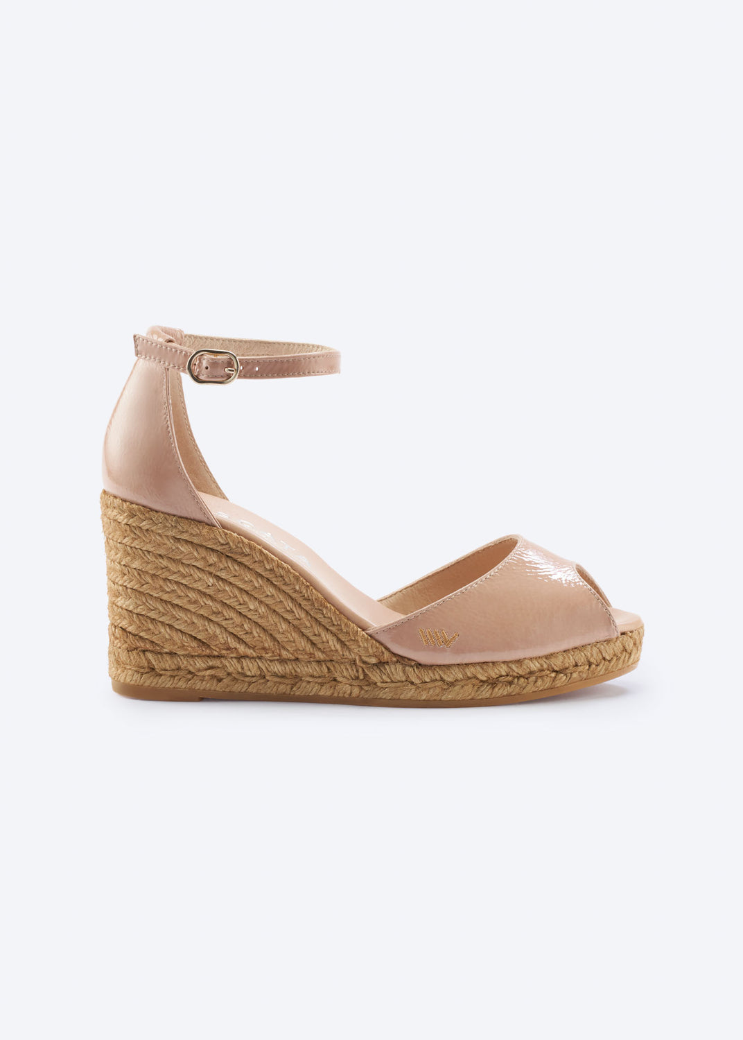 Side view of blush pink leather wedge espadrille sandal with ankle strap, open toe, and natural braided jute wedge, handcrafted in Spain
