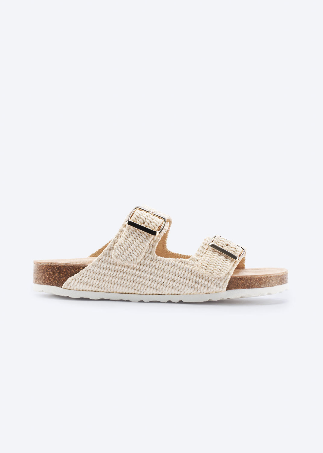Natural raffia double-buckle slide sandal, side view.