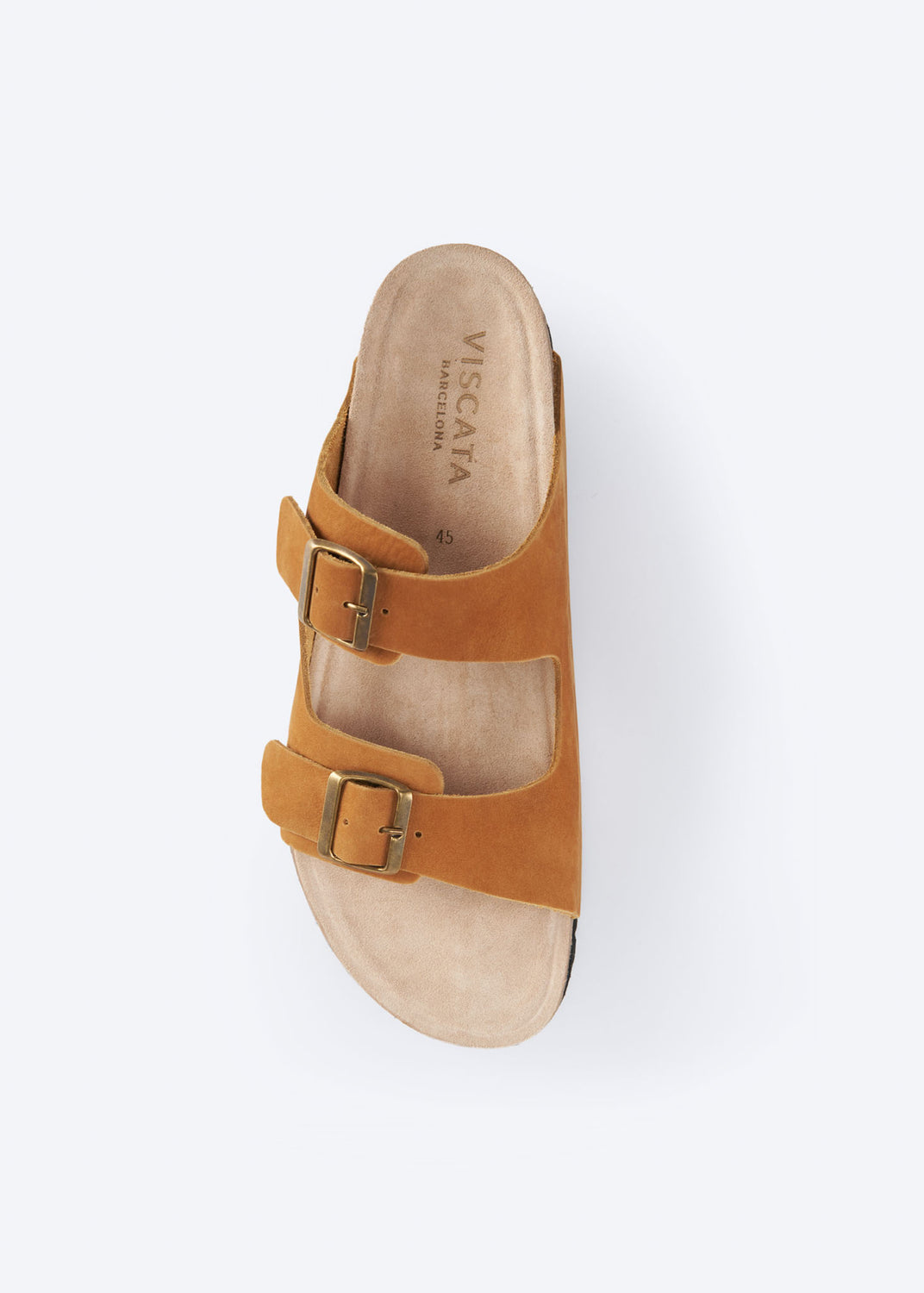 Top view of a camel suede double-buckle slide sandal.