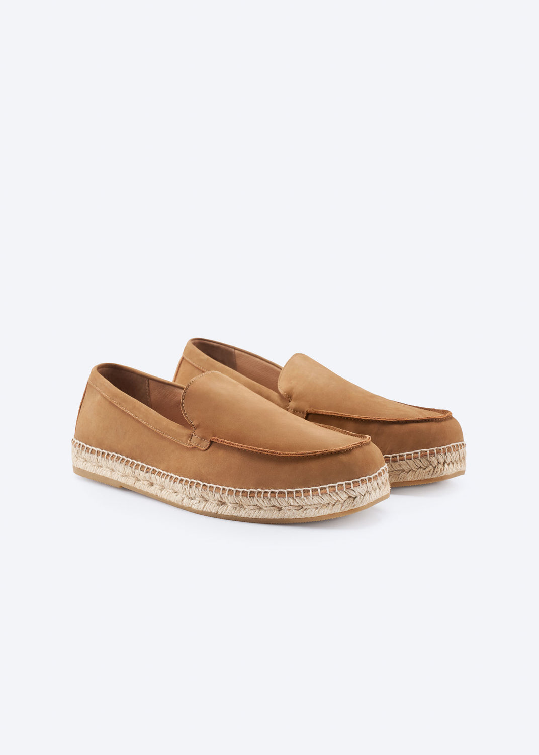 Pair of camel suede espadrille loafers, angled view.
