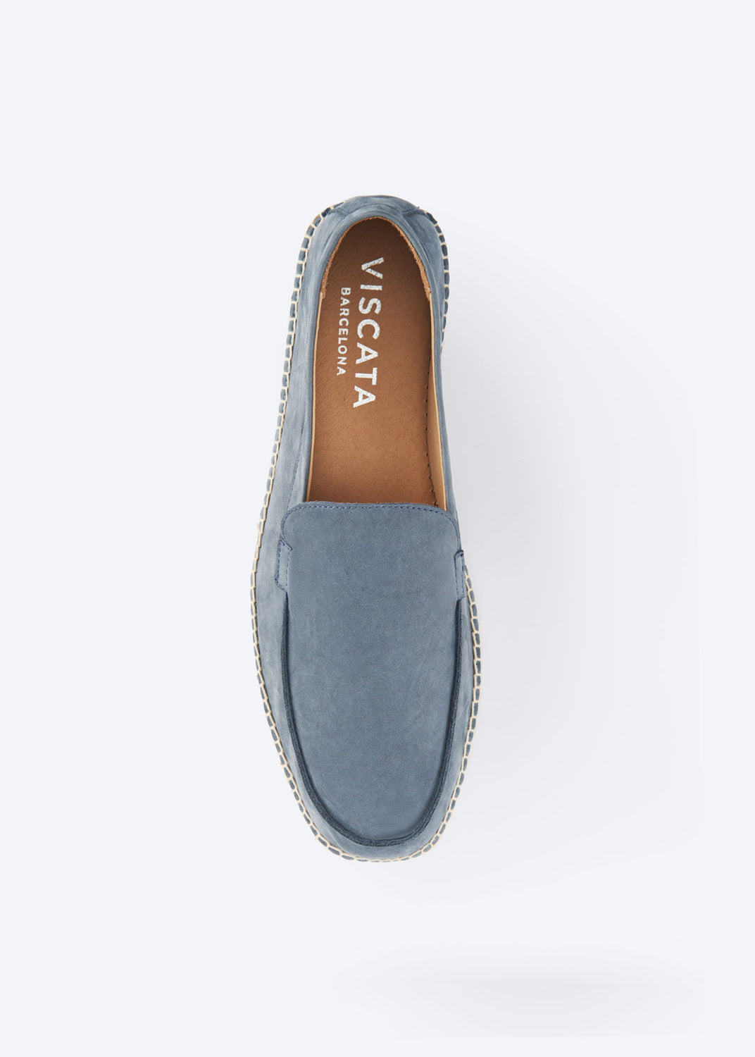 Top view of a navy blue suede espadrille loafer.
