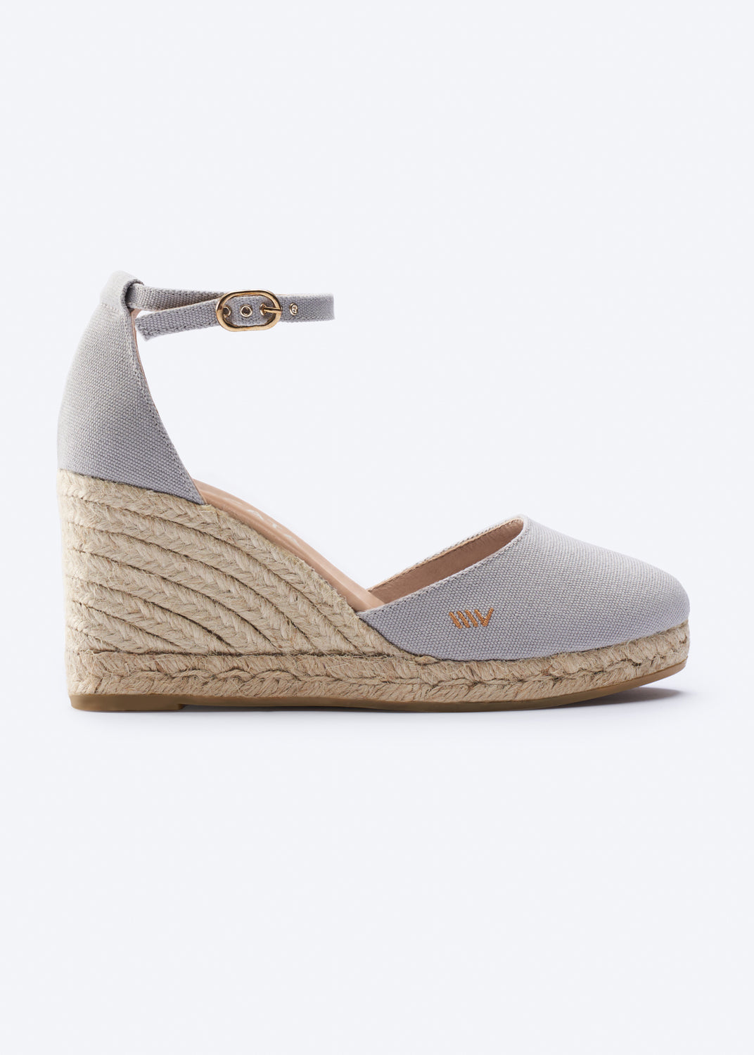 Gray wedge sandal with espadrille sole on a white background