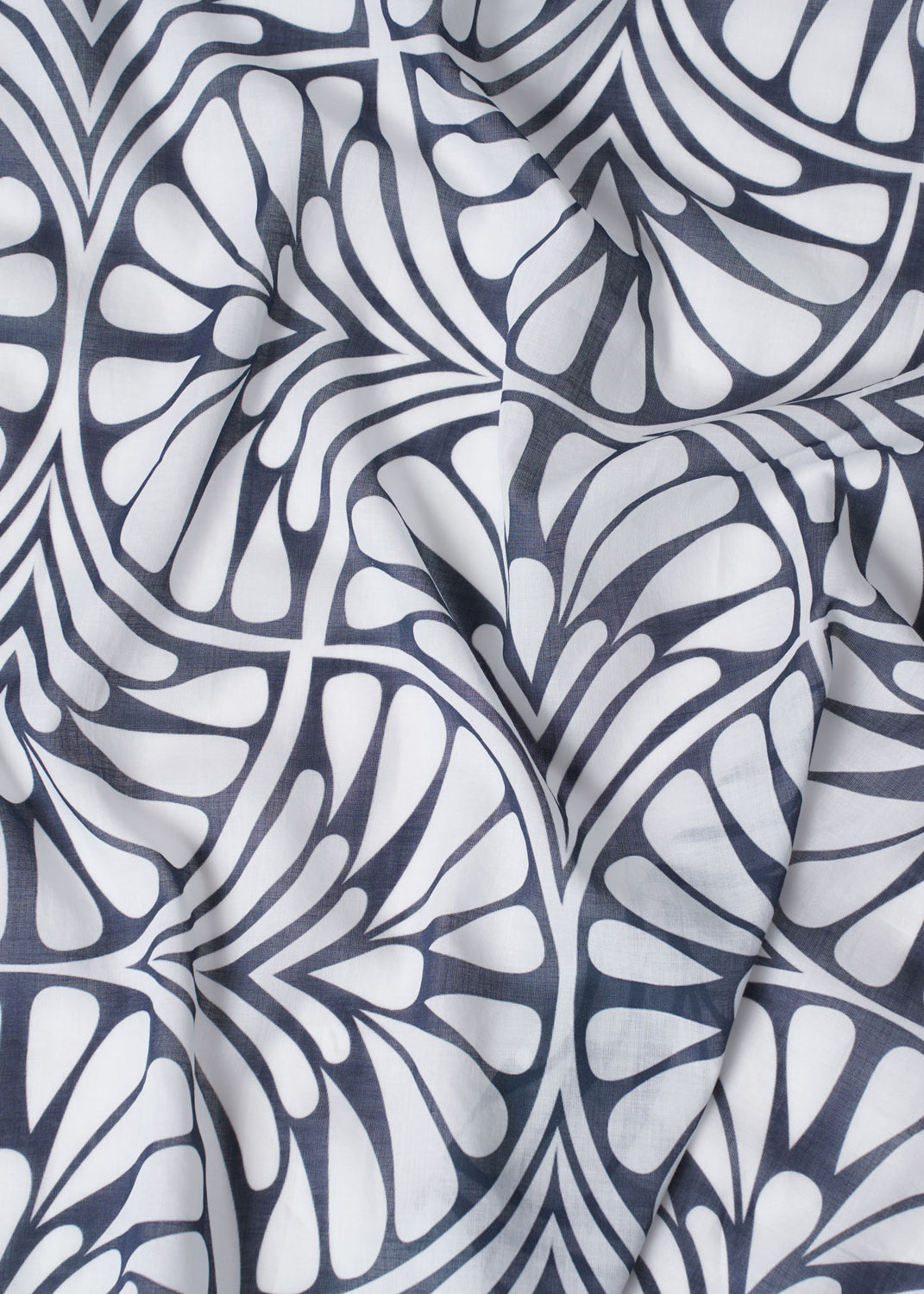 Close-up of the Blue Palms foulard, showcasing a bold navy and white geometric palm motif with natural fabric folds and a soft, airy texture