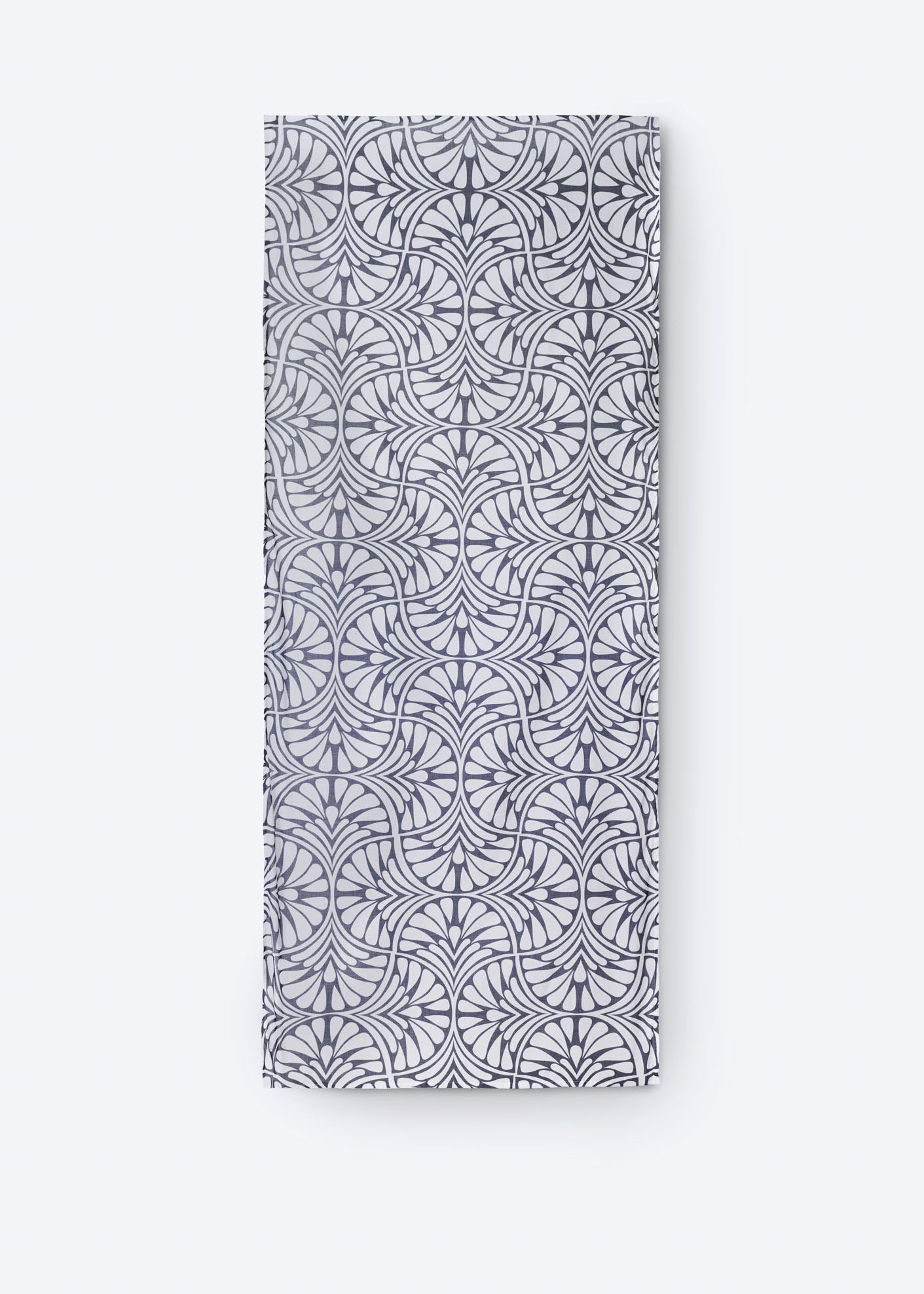 Flat lay of the Blue Palms foulard, showcasing its full-length geometric palm motif in navy and white on lightweight cotton fabric