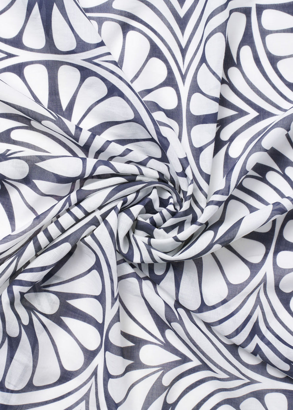 Close-up of the Blue Palms foulard with fabric twisted into a spiral, highlighting the bold navy and white geometric palm pattern and soft cotton texture