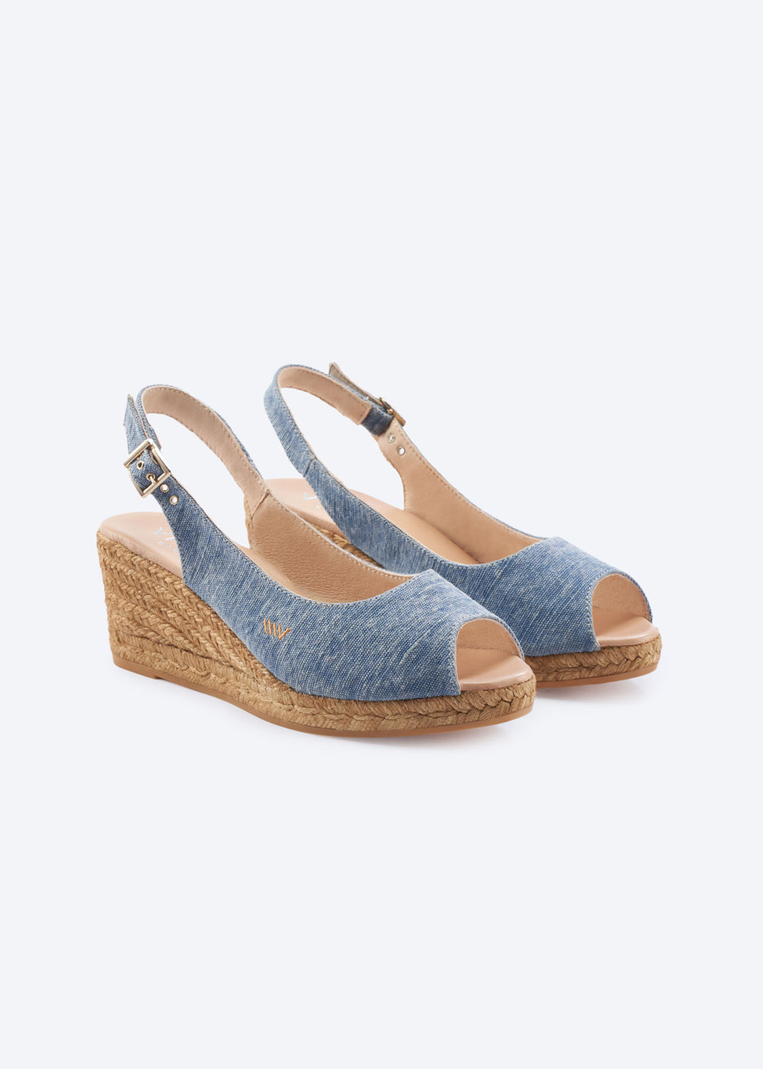 Washed denim wedge espadrille sandals with slingback straps, open toe, and a natural braided jute wedge, handcrafted in Spain