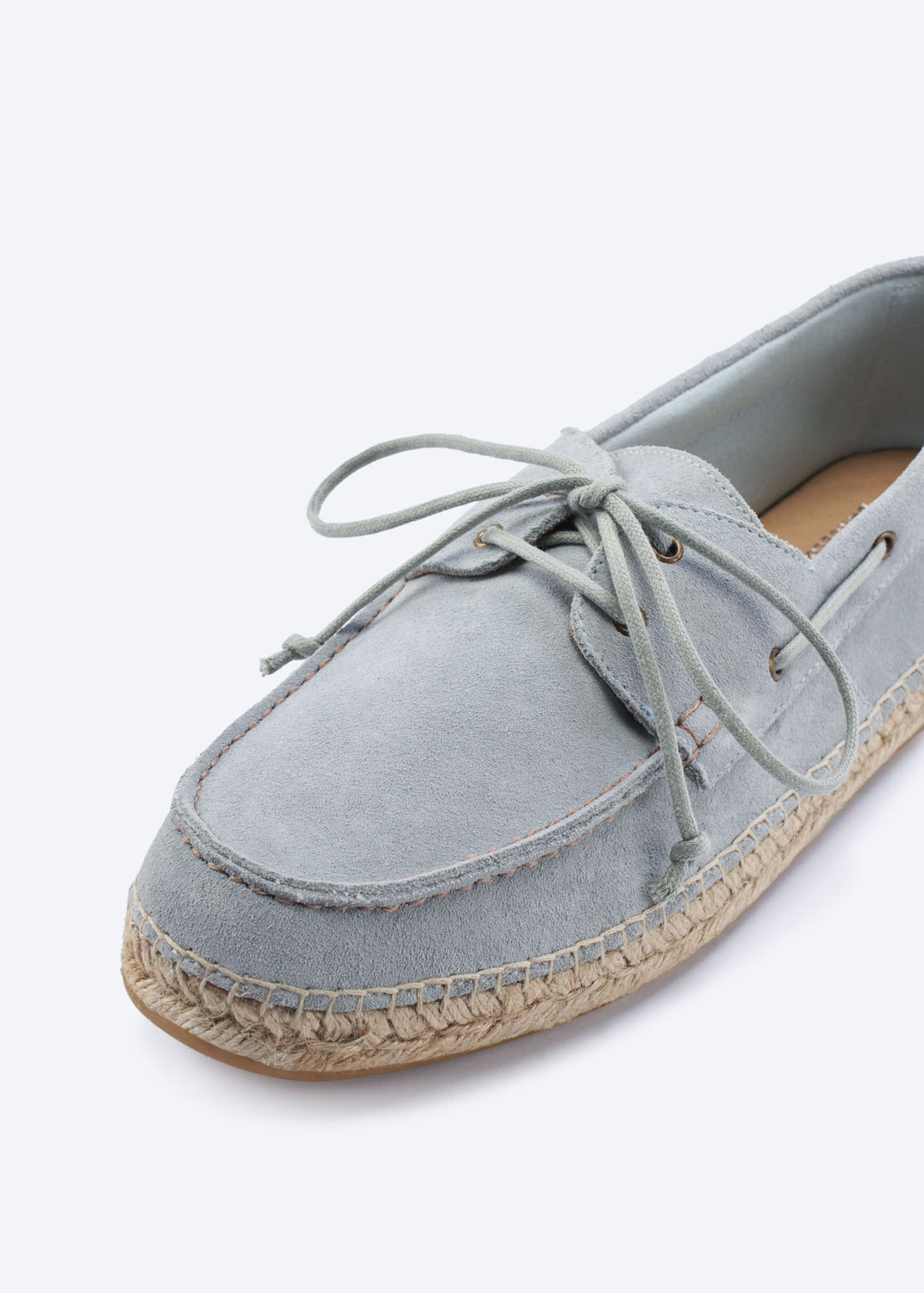 Close-up of a men’s light grey suede espadrille boat shoe with lace detail, moc-toe stitching, and hand-finished jute-wrapped sole.