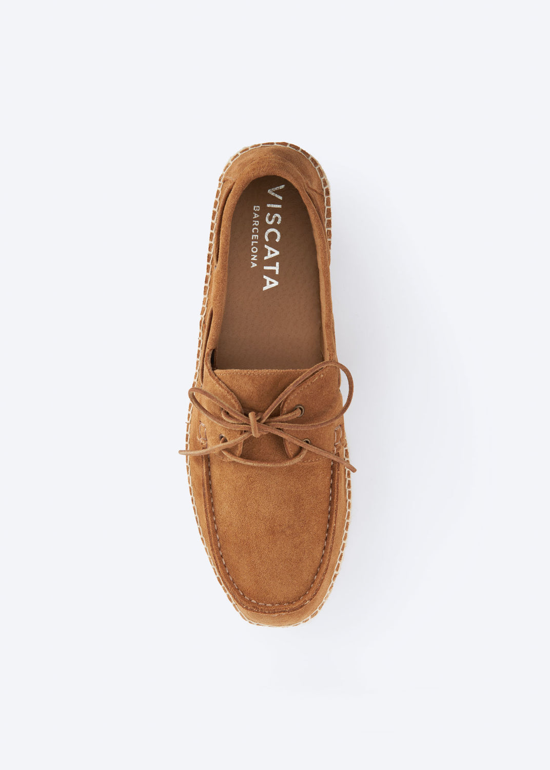 Top view of a men’s tan suede espadrille boat shoe with lace detail and natural jute-wrapped sole, handcrafted in Spain.