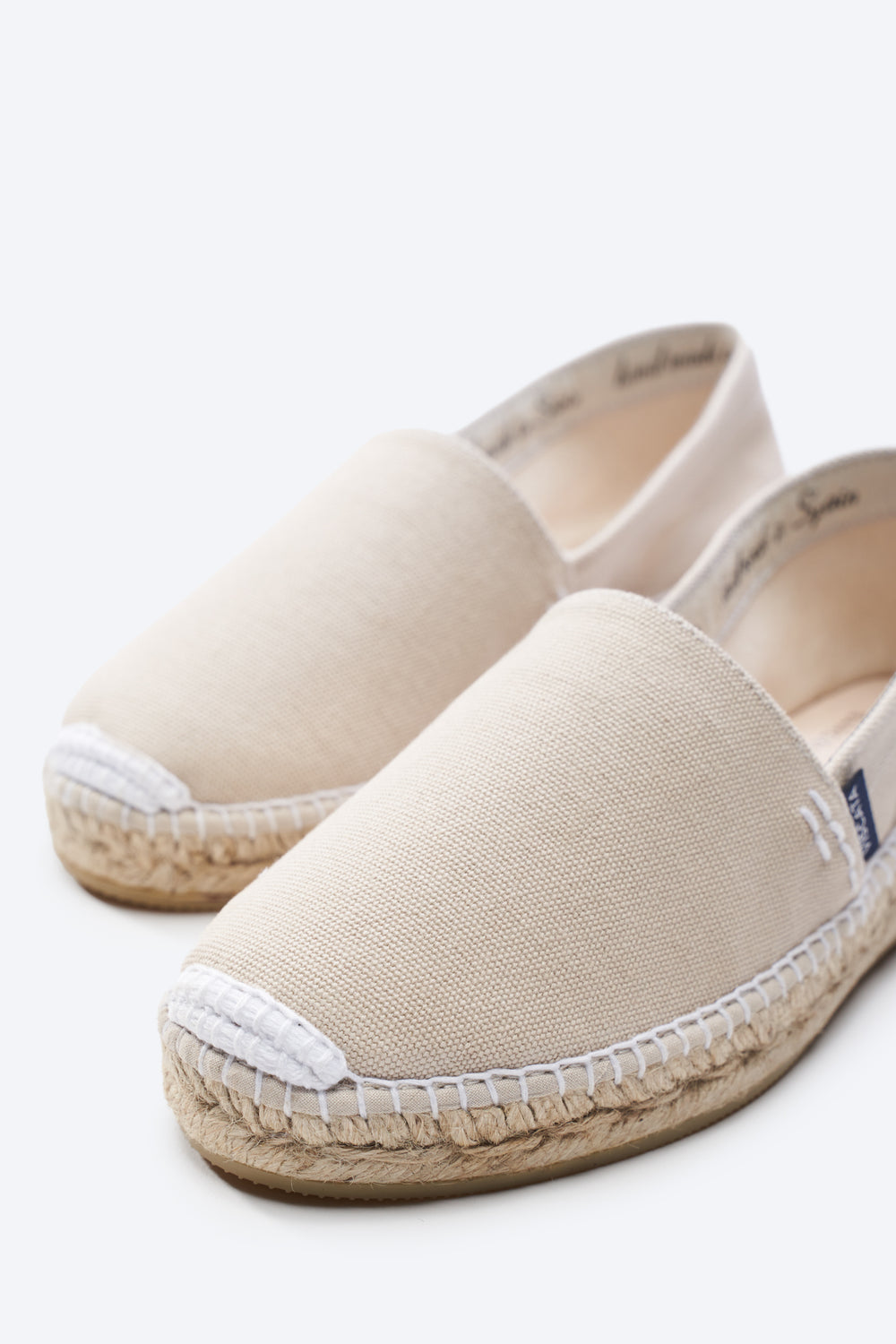 Llafranc Beige Canvas Slip On Women Espadrille Flats Closed Toe White Stitch Detail