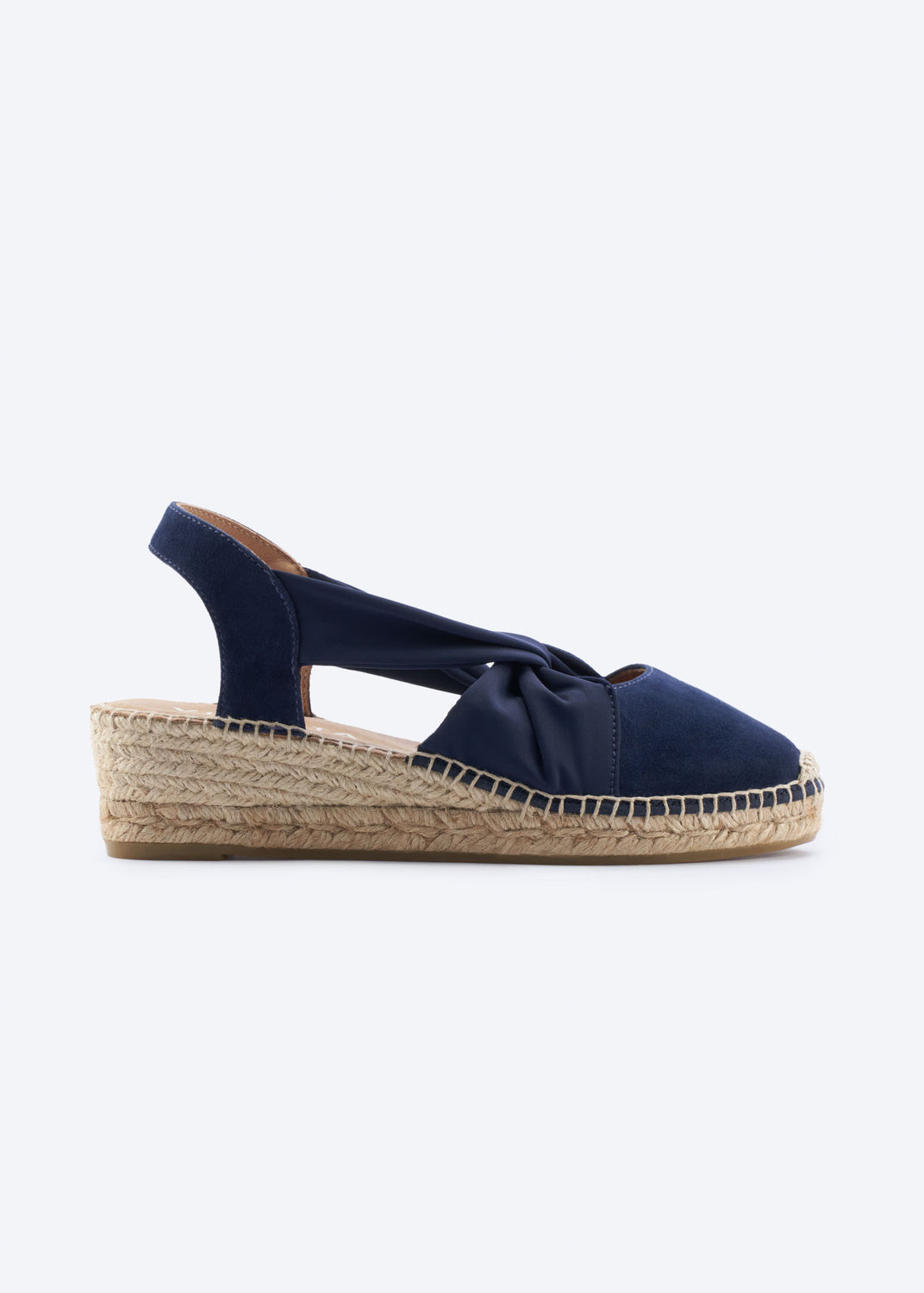 Navy suede slingback espadrille wedge with knot detail, side view.