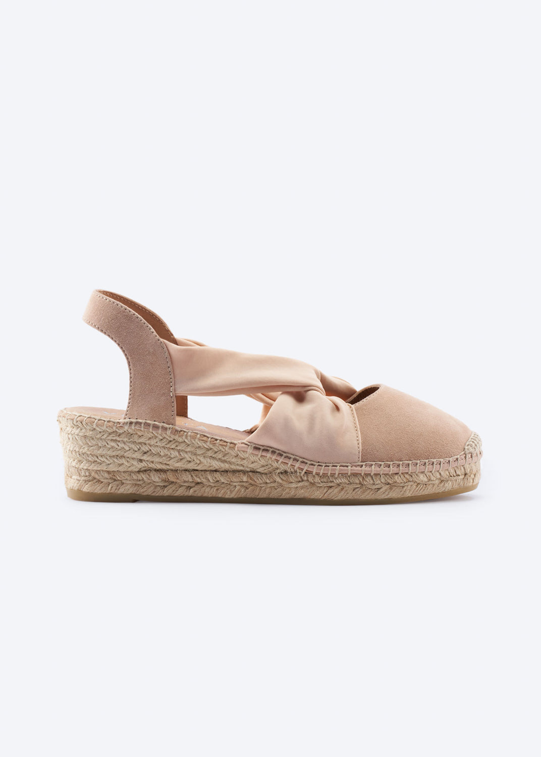Nude suede slingback espadrille wedge with knot strap, side view.