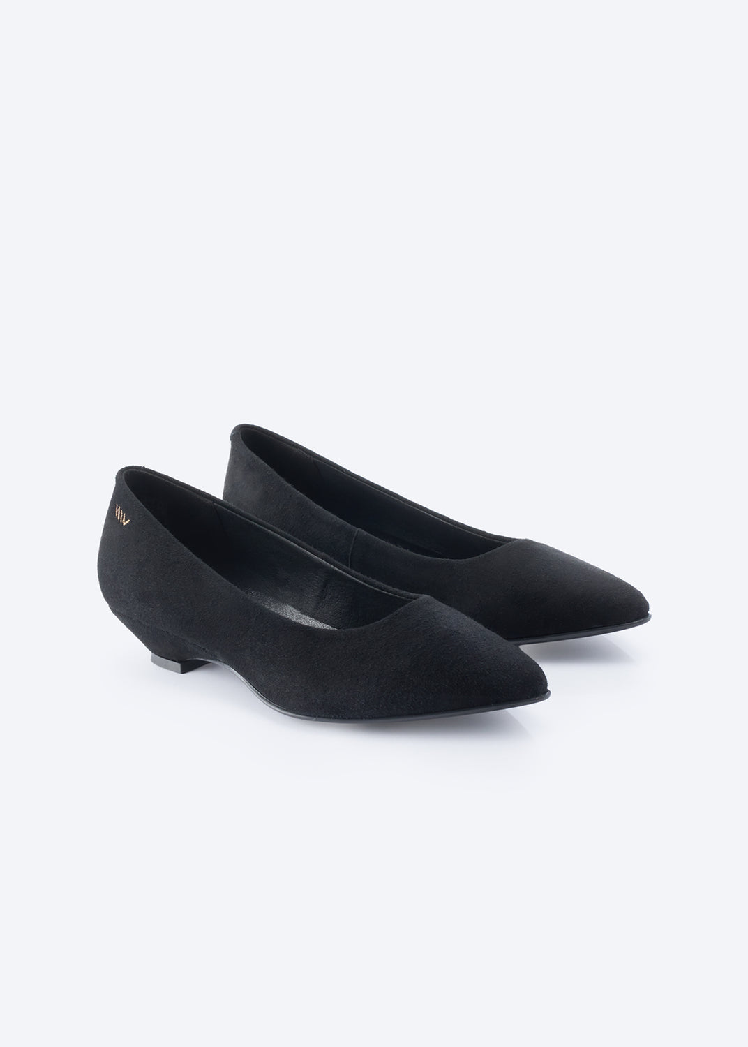 A pair of black pointed-toe flats with a low block heel, shown on a clean white background.
