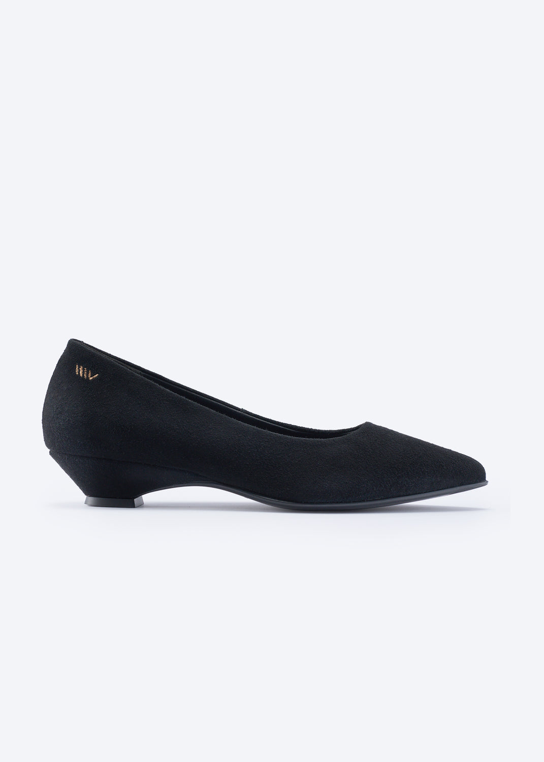 A single black pointed-toe flat shoe with a low block heel, shown in profile against a clean white background. A small gold logo is visible on the heel counter.