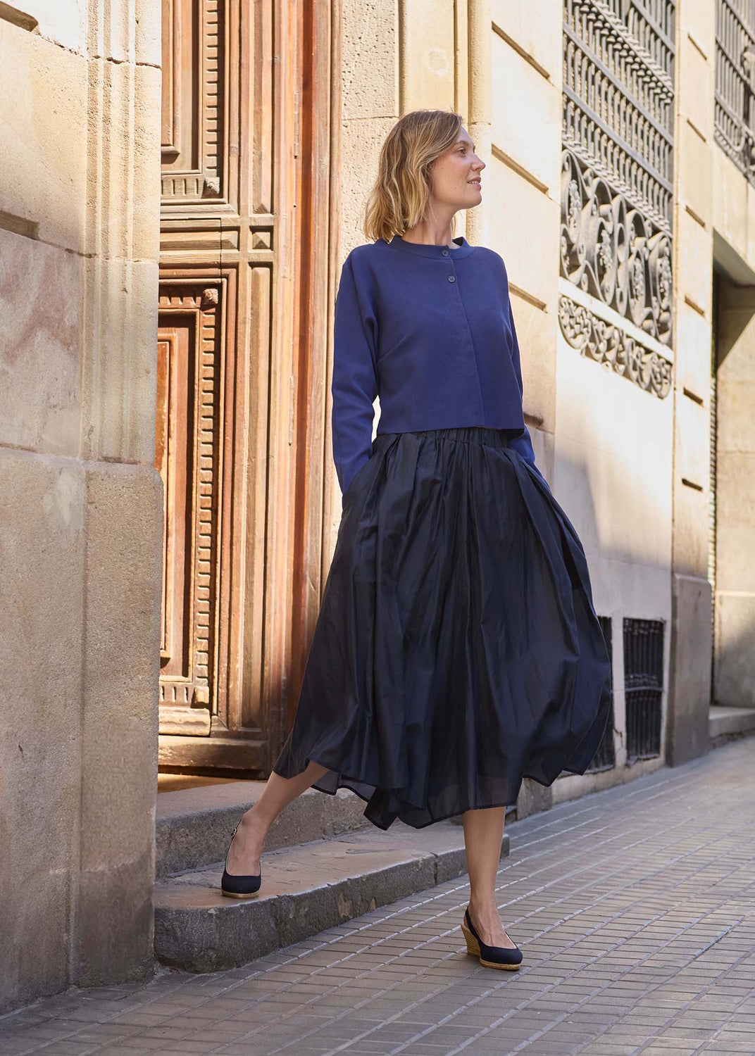 Woman wearing VISCATA Palomera black slingback espadrille wedges on the streets of Barcelona