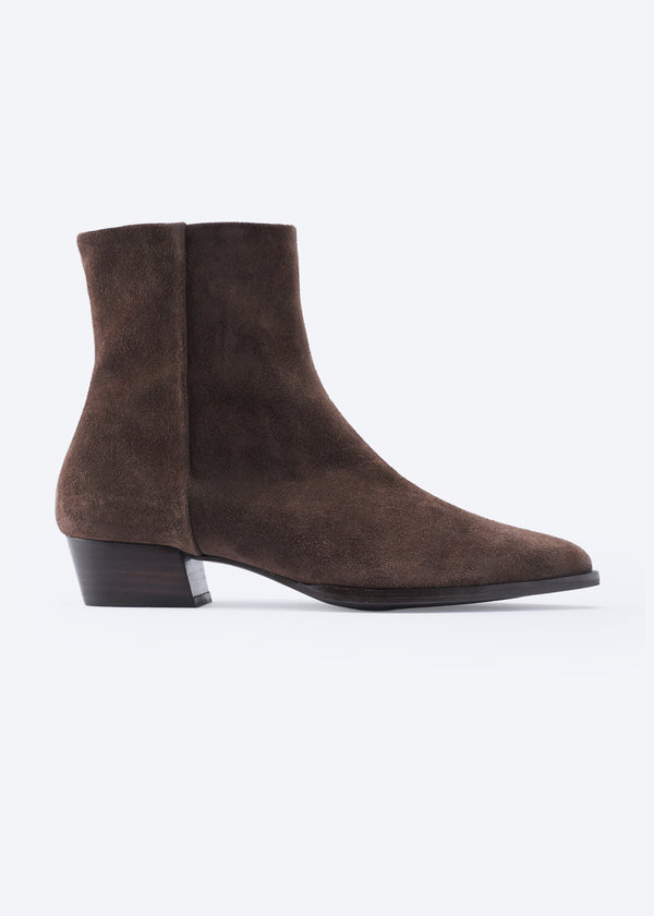 A single dark brown suede ankle boot with a low block heel and pointed toe, shown in profile against a plain white background.