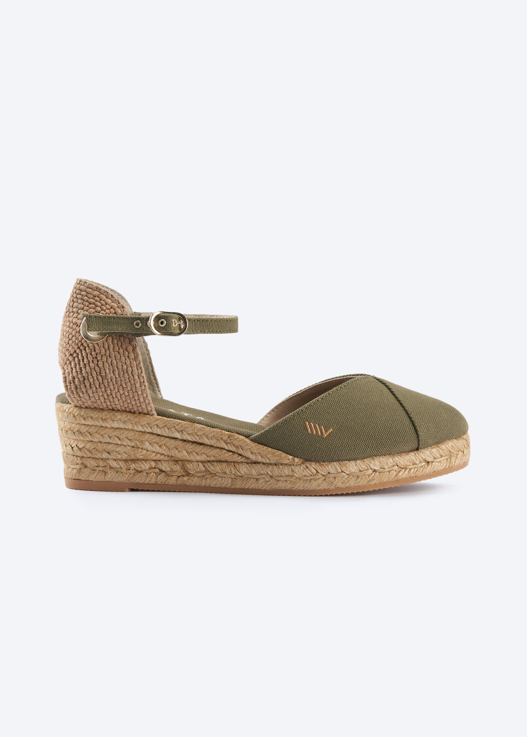 Side view of olive green espadrille sandal with ankle strap, closed toe, and natural braided jute wedge, handcrafted in Spain