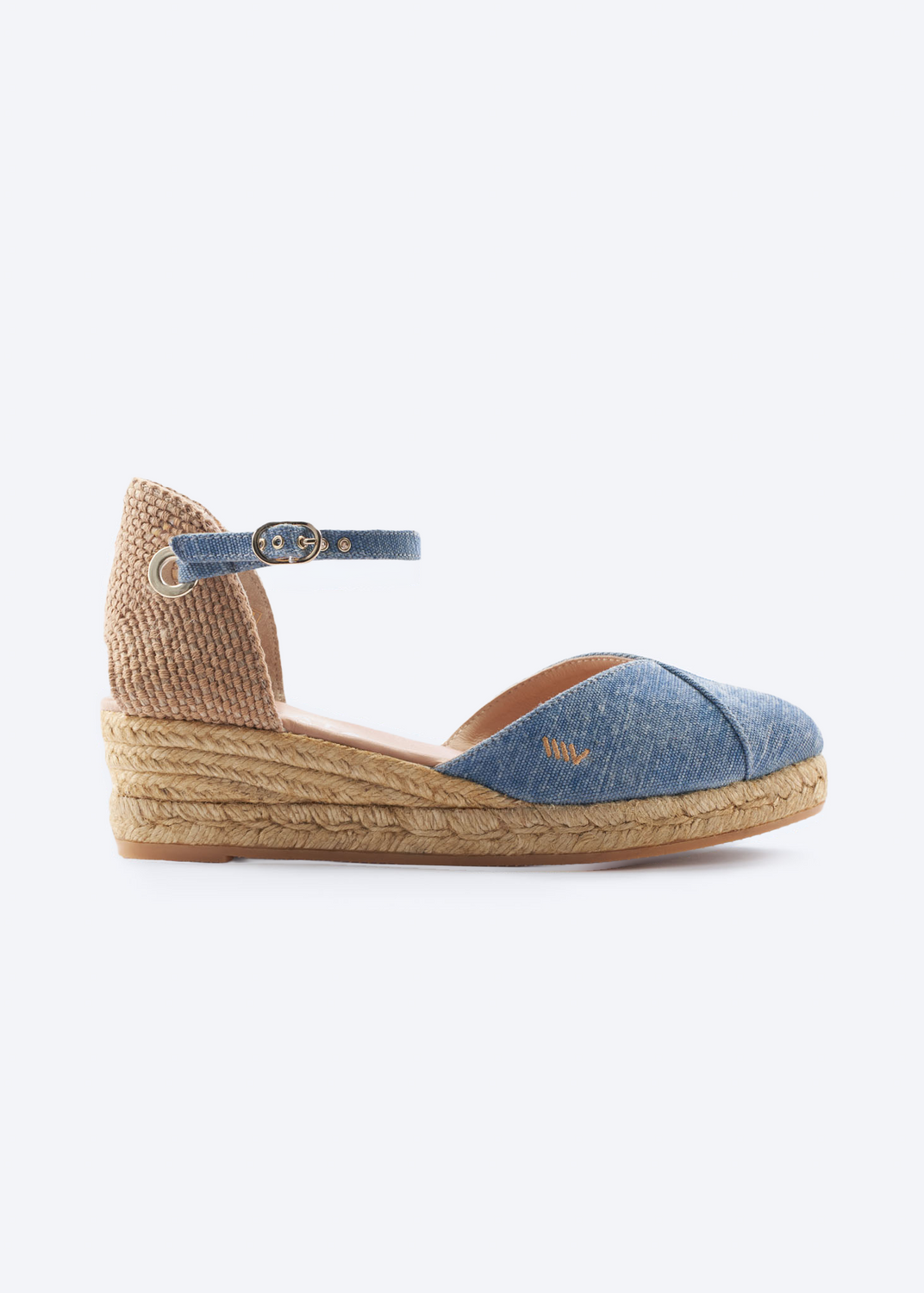 Blue denim espadrille wedge sandals with ankle strap shown on a clean studio background.