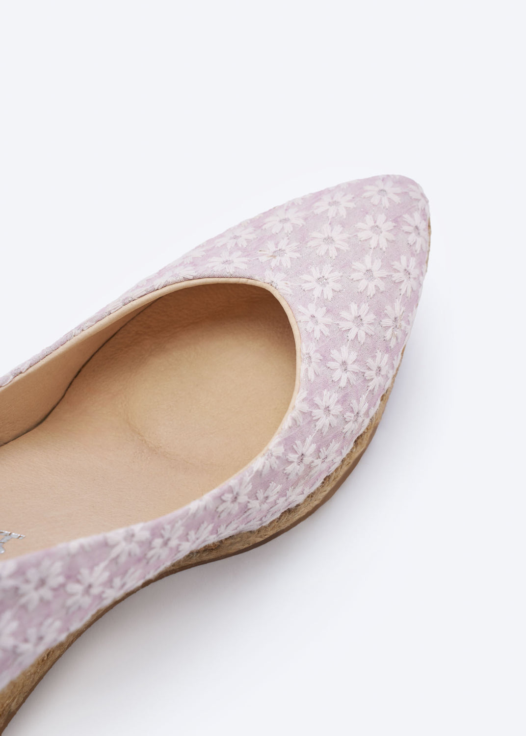 Close-up of a pale pink floral wedge espadrille pump with a pointed toe, handcrafted in Spain
