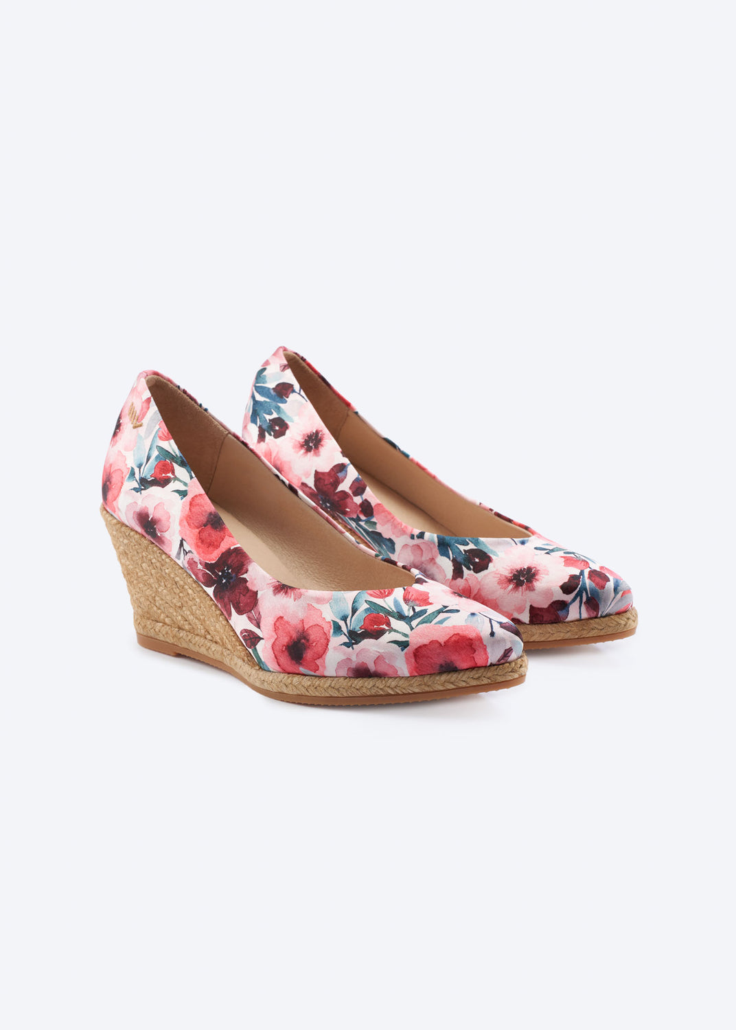 Floral print wedge espadrille pumps with a pointed toe and natural braided jute wedge, handcrafted in Spain