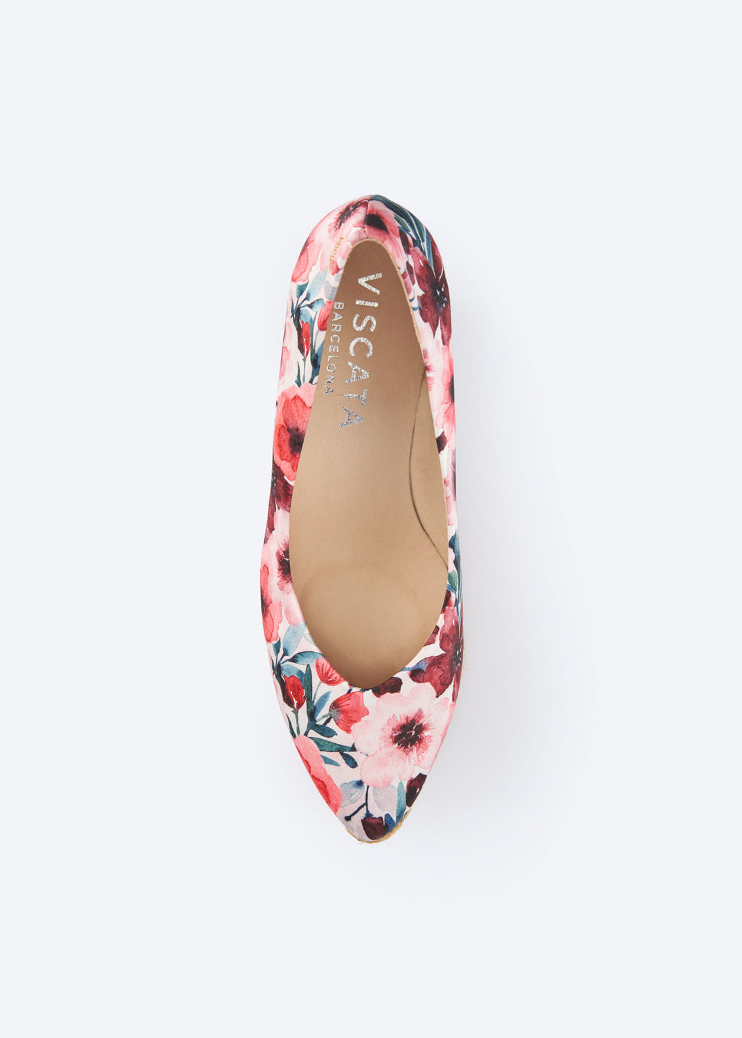 Top view of floral print wedge espadrille pumps with a pointed toe silhouette, handcrafted in Spain