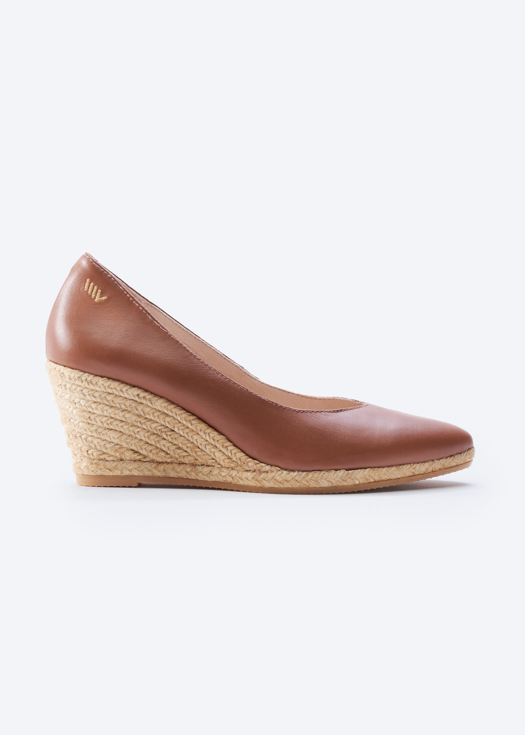 Brown leather espadrille wedge pump, side view.