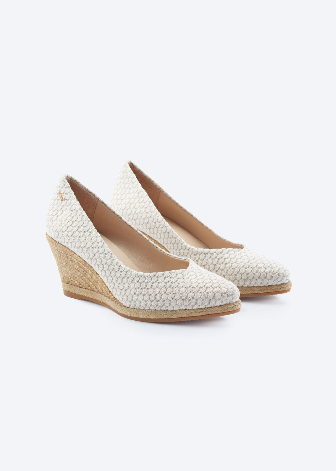 White mesh wedge espadrille pumps with a pointed toe and natural braided jute wedge, handcrafted in Spain