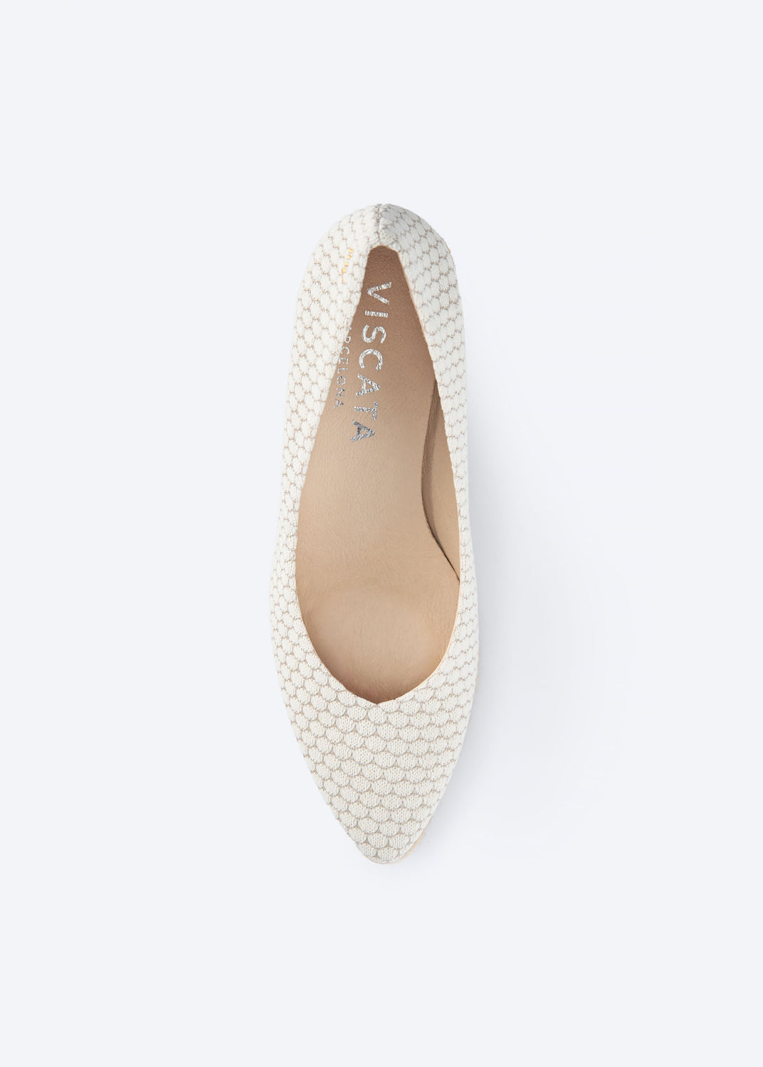 Top view of white mesh wedge espadrille pumps with a pointed toe silhouette, handcrafted in Spain