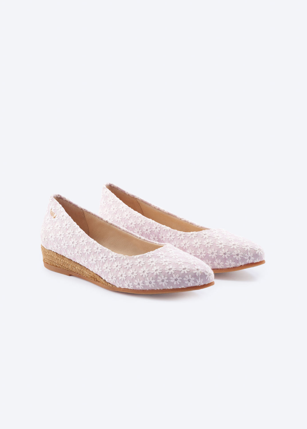 Pale pink floral espadrille flats with a pointed toe and natural braided jute sole, handcrafted in Spain