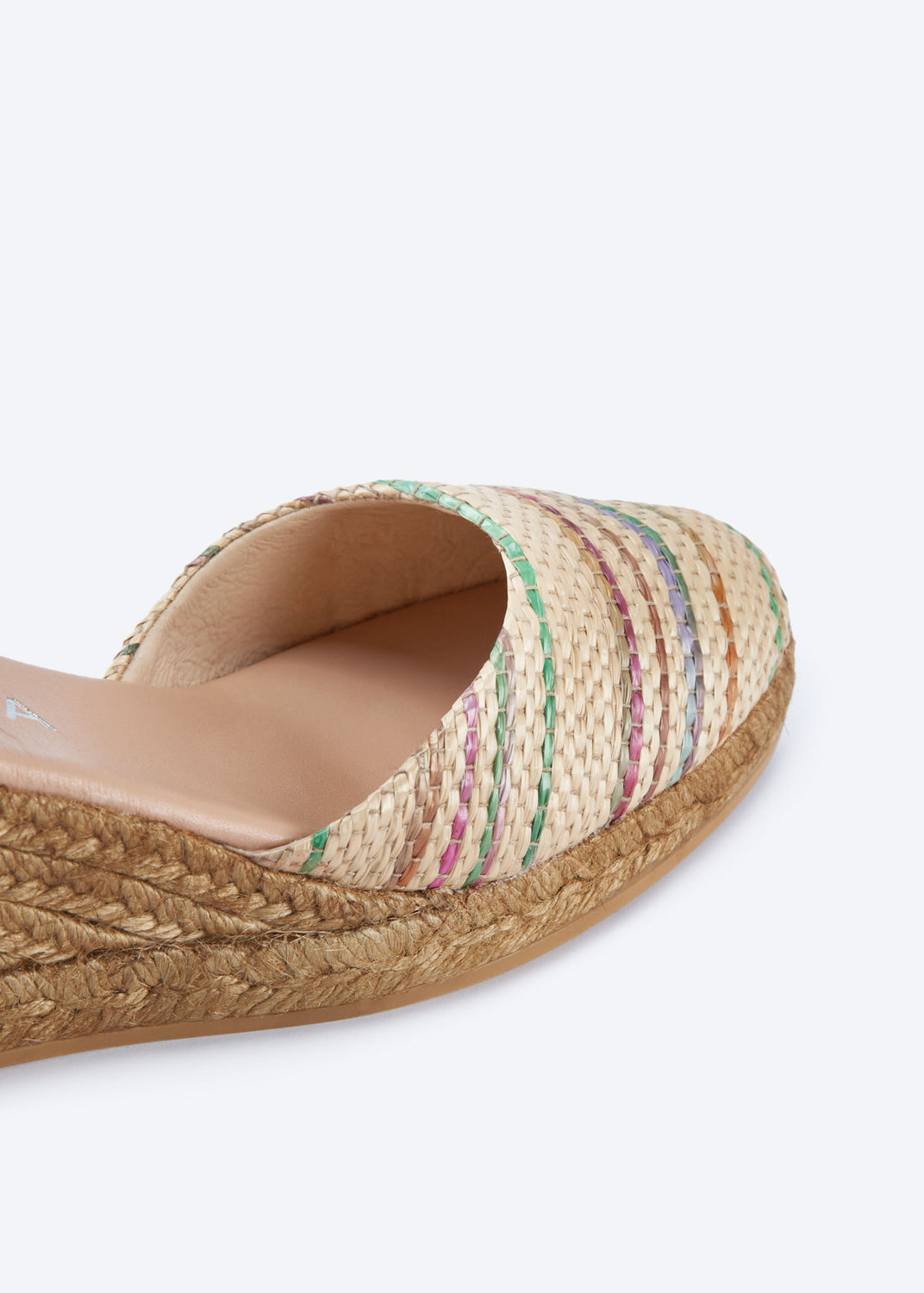 Close-up of multicolor raffia espadrille wedge with a pointed closed toe and natural braided jute sole, handcrafted in Spain
