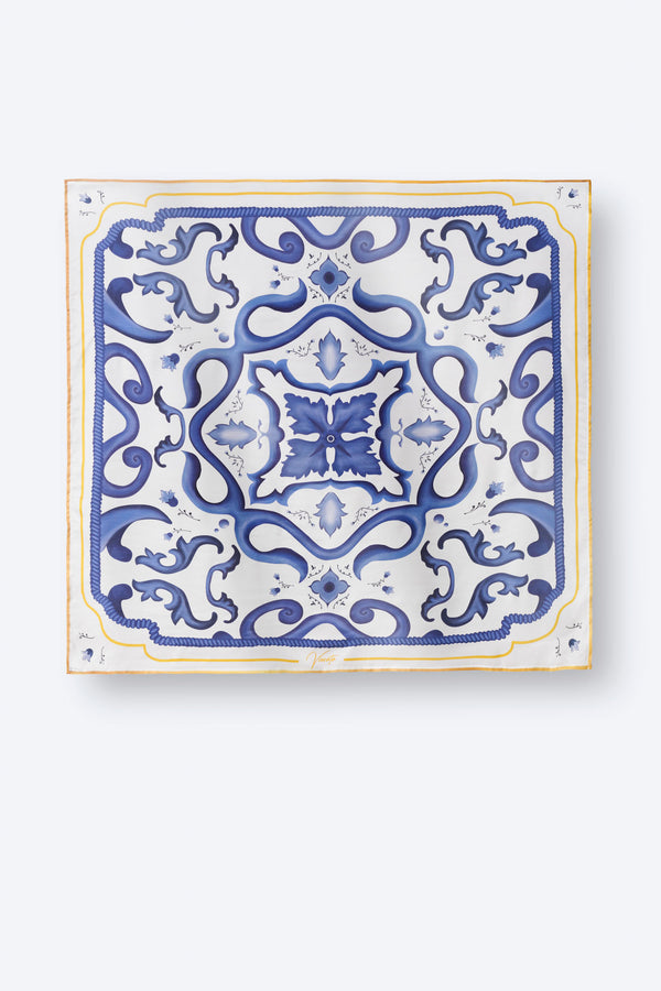 Luxury square scarf with bold blue and white Italian tile-inspired print and subtle yellow border – elegant women's accessory for timeless Mediterranean flair and resort-ready style