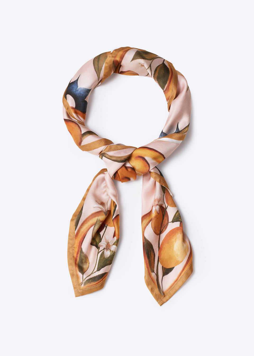 Chic silk neck scarf with hand-painted orange fruit and floral motif on a blush background – stylish and versatile women's accessory perfect for Mediterranean-inspired outfits and elegant summer looks
