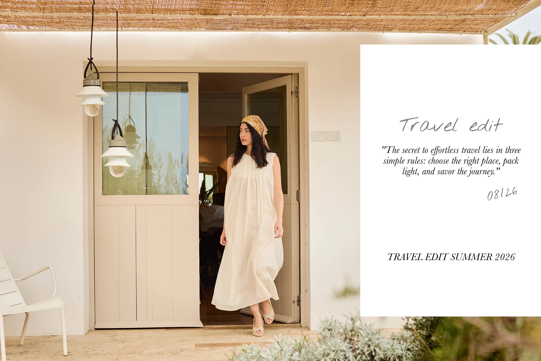 A woman wearing a cream-colored sleeveless maxi dress and a straw hat stands in a doorway of a modern beige building. To the right is a large white graphic overlay with the text 'Travel edit' and a quote.