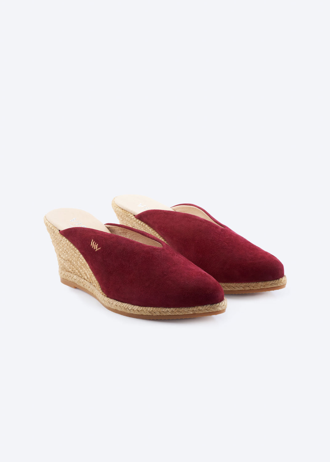 Burgundy suede wedge espadrille mules with a closed toe and natural braided jute wedge, handcrafted in Spain