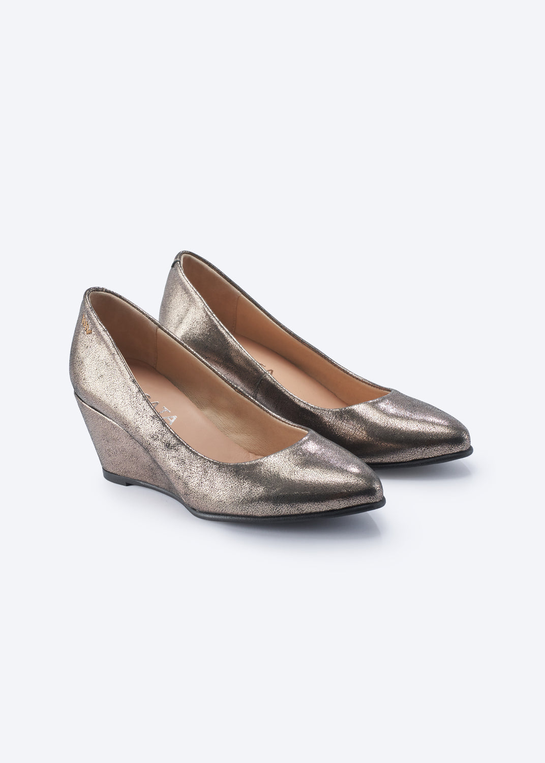 A pair of metallic gold wedge pumps with a textured, distressed finish and pointed toes, shown on a light gray background.