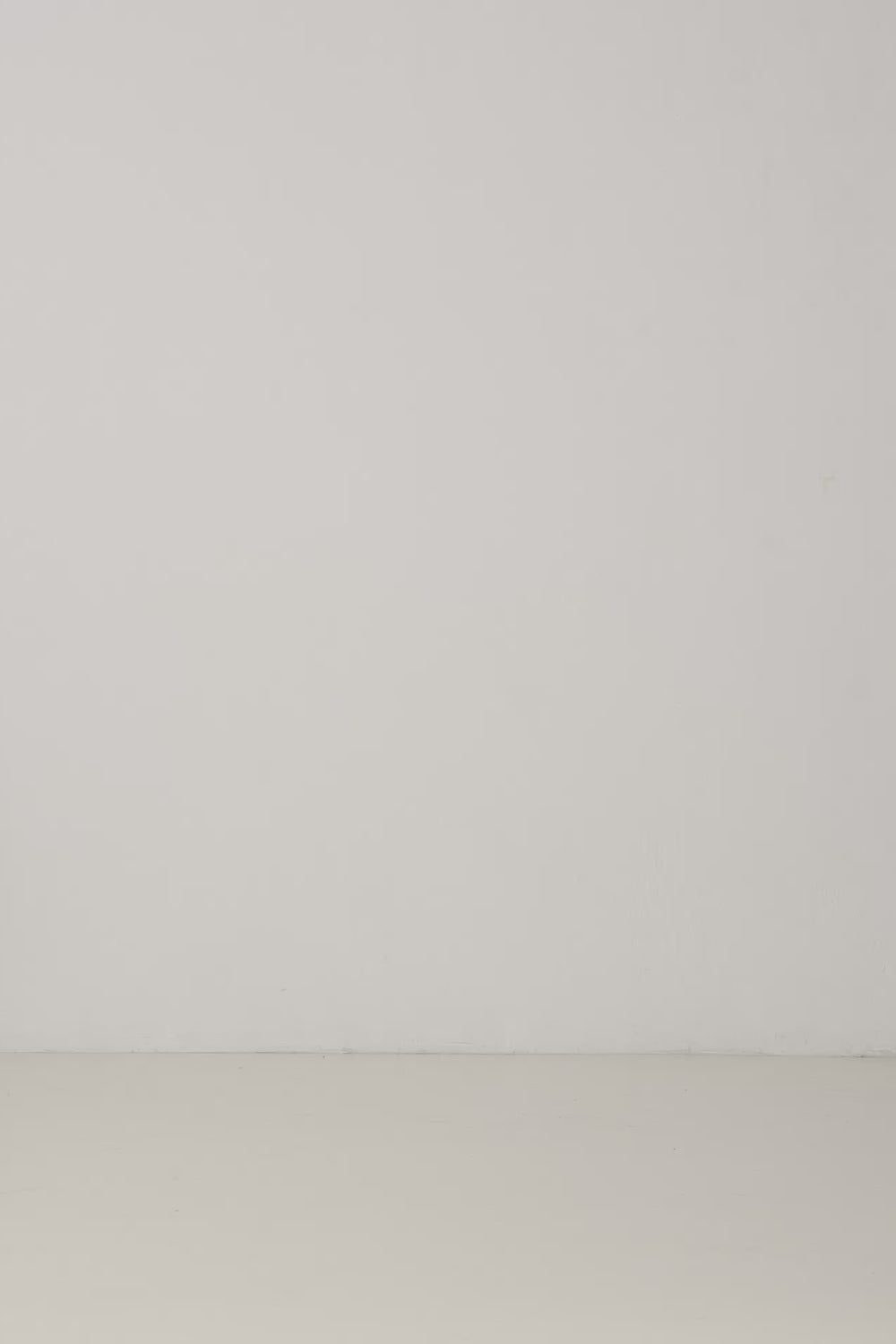 Navy canvas lace-up espadrille wedges styled with a flowing olive skirt in a minimalist studio setting.