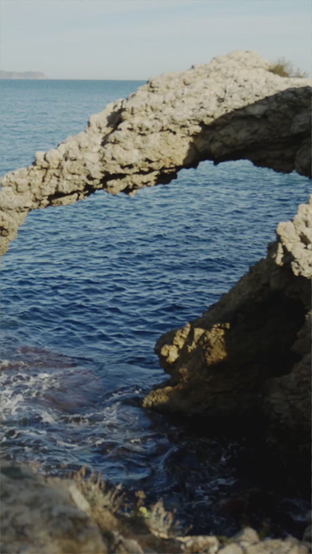 Coastal hero video featuring black canvas slip-on espadrille wedges with a jute-wrapped wedge sole