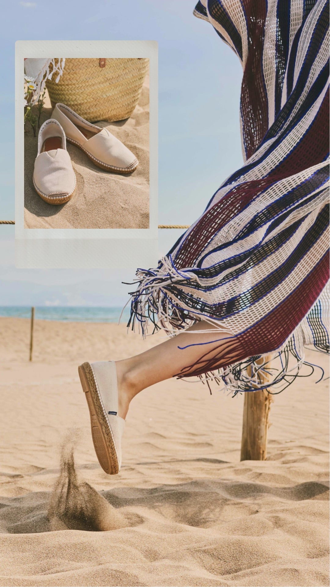 Person walking on a sandy beach with a striped towel and sandals, framed by a polaroid-style border.